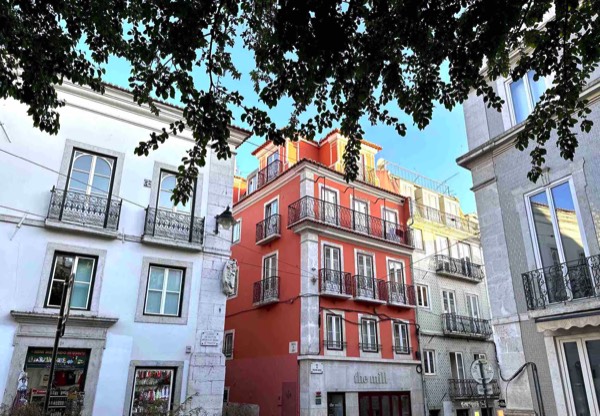 Photo of buildings in a Lisbon neighborhood with wrought iron balconies